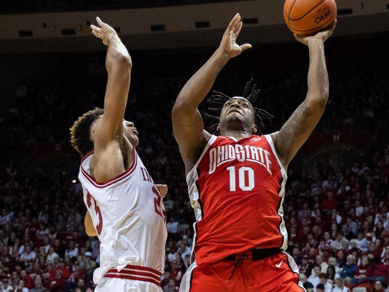 Jan 28, 2023; Bloomington, Indiana, USA; Ohio State Buckeyes forward Brice Sensabaugh (10) shoots the ball while Indiana Hoosiers forward Trayce Jackson-Davis (23) defends in the second half at Simon Skjodt Assembly Hall. Mandatory Credit: Trevor Ruszkowski-USA TODAY Sports