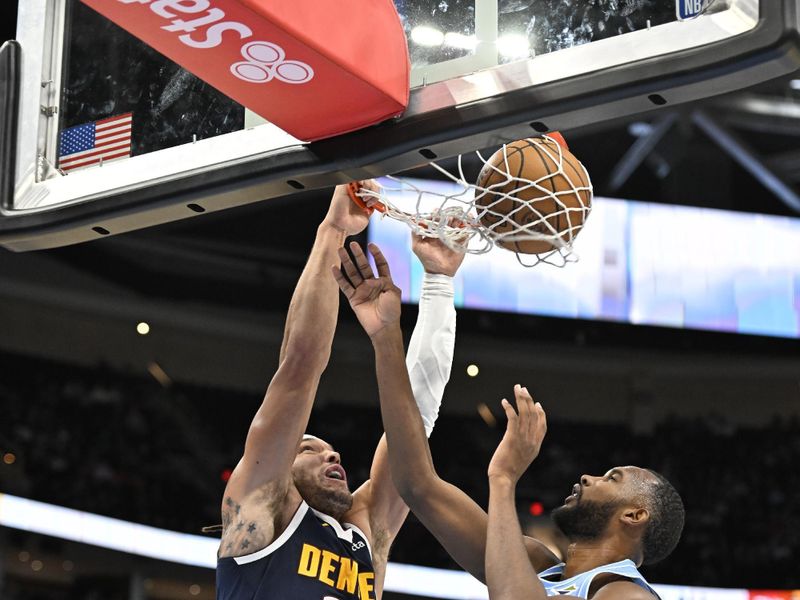 CLEVELAND, OH - DECEMBER 8: Aaron Gordon #32 of the Denver Nuggets dunks the ball during the game against the Cleveland Cavaliers on December 5, 2024 at Rocket Mortgage FieldHouse in Cleveland, Ohio. NOTE TO USER: User expressly acknowledges and agrees that, by downloading and/or using this Photograph, user is consenting to the terms and conditions of the Getty Images License Agreement. Mandatory Copyright Notice: Copyright 2024 NBAE (Photo by David Liam Kyle/NBAE via Getty Images)