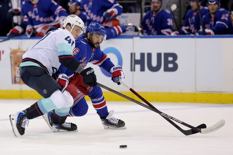 Jan 12, 2026; New York, New York, USA; Seattle Kraken defenseman Ryker Evans (41) interferes with New York Rangers center Vincent Trocheck (16) during the second period at Madison Square Garden. Mandatory Credit: Brad Penner-Imagn Images