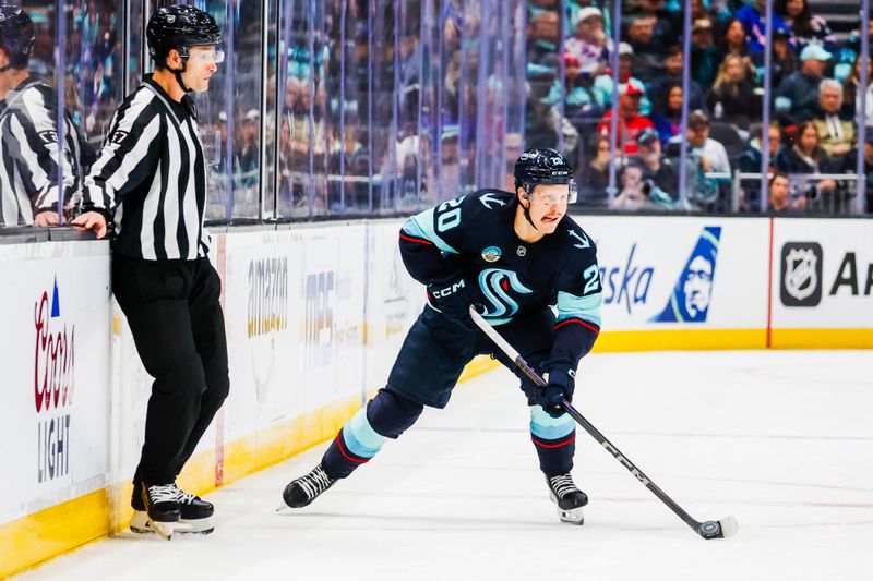 Nov 17, 2024; Seattle, Washington, USA; Seattle Kraken right wing Eeli Tolvanen (20) skates with the puck against the New York Rangers during the first period at Climate Pledge Arena. Mandatory Credit: Joe Nicholson-Imagn Images