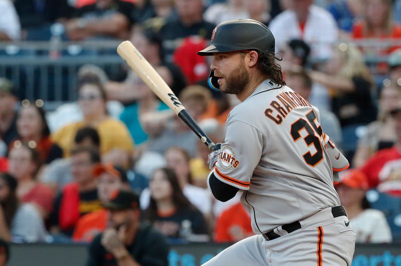 Jul 14, 2023; Pittsburgh, Pennsylvania, USA; San Francisco Giants shortstop Brandon Crawford (35) hits a single against the Pittsburgh Pirates during the fifth inning at PNC Park. Mandatory Credit: Charles LeClaire-USA TODAY Sports