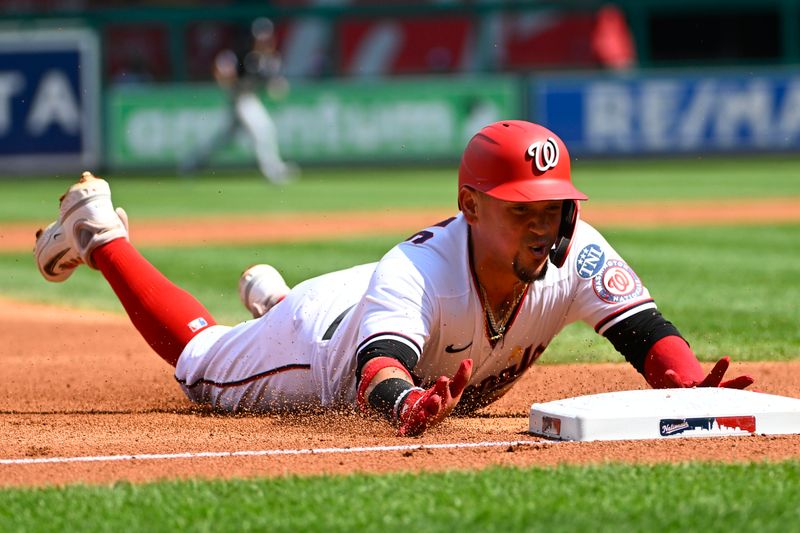 Sep 20, 2023; Washington, District of Columbia, USA; Washington Nationals third baseman Ildemaro Vargas (14) slides into third base against the Chicago White Soxduring the second inning at Nationals Park. Mandatory Credit: Brad Mills-USA TODAY Sports