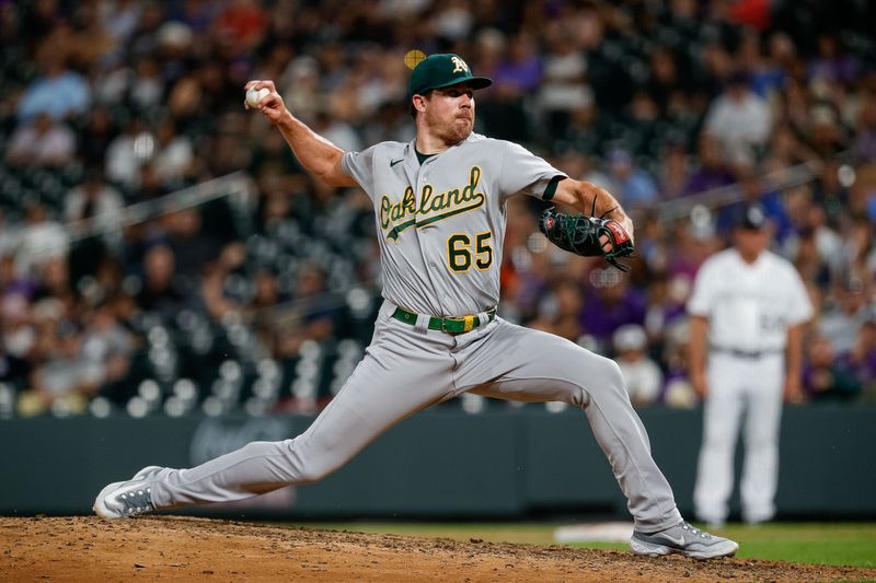 Jul 28, 2023; Denver, Colorado, USA; Oakland Athletics relief pitcher Trevor May (65) pitches in the ninth inning against the Colorado Rockies at Coors Field. Mandatory Credit: Isaiah J. Downing-USA TODAY Sports