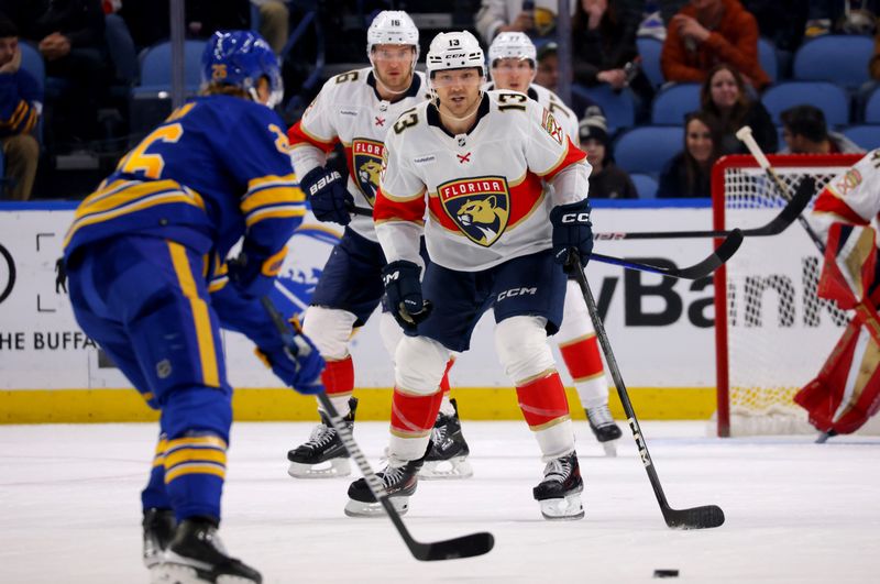 Feb 15, 2024; Buffalo, New York, USA;  Florida Panthers center Sam Reinhart (13) defends during the third period against the Buffalo Sabres at KeyBank Center. Mandatory Credit: Timothy T. Ludwig-USA TODAY Sports