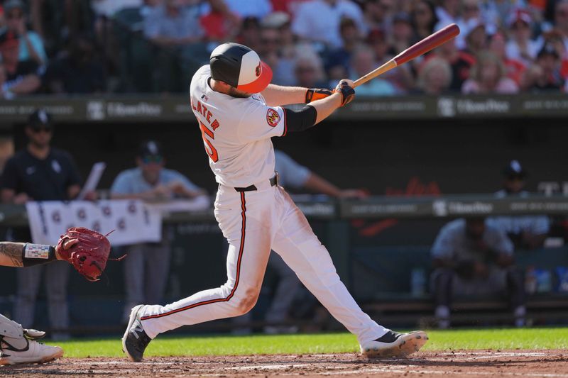 Sep 2, 2024; Baltimore, Maryland, USA; Baltimore Orioles outfielder Austin Slater (15) drives in a run during the third inning against the Chicago White Sox at Oriole Park at Camden Yards. Mandatory Credit: Mitch Stringer-USA TODAY Sports