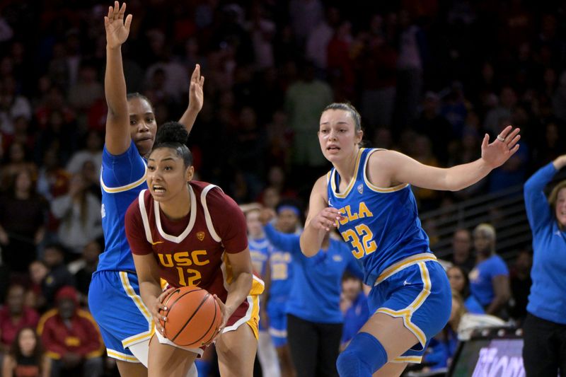 Jan 14, 2024; Los Angeles, California, USA; UCLA Bruins guard Charisma Osborne (20) and UCLA Bruins forward Angela Dugalic (32) defend a pass by USC Trojans guard JuJu Watkins (12) in the second half at Galen Center. Mandatory Credit: Jayne Kamin-Oncea-USA TODAY Sports