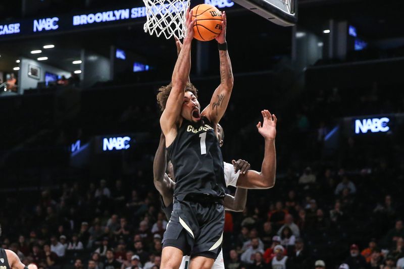 Dec 10, 2023; Brooklyn, New York, USA;  Colorado Buffaloes guard J'Vonne Hadley (1) grabs a rebound in the first half against the Miami (Fl) Hurricanes at Barclays Center. Mandatory Credit: Wendell Cruz-USA TODAY Sports