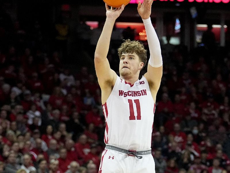 Feb. 18, 2023; Madison, WI, USA; Wisconsin Badgers guard Max Klesmit (11) shoots during the second half against the Rutgers Scarlet Knights at the Kohl Center. Rutgers beat Wisconsin 58-57. Mandatory Credit: Mark Hoffman-USA TODAY Sports