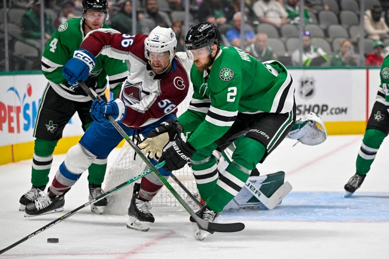 Oct 3, 2022; Dallas, Texas, USA; Dallas Stars defenseman Miro Heiskanen (4) and defenseman Jani Hakanpaa (2) defend against Colorado Avalanche defenseman Kurtis MacDermid (56) during the third period at the American Airlines Center. Mandatory Credit: Jerome Miron-USA TODAY Sports