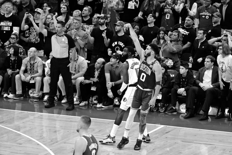 BOSTON, MA - JUNE 17: (EDITOR'S NOTE: Image has been converted to black and white) Jayson Tatum #0 of the Boston Celtics looks on during the game against the Dallas Mavericks during Game Five of the 2024 NBA Finals on June 17, 2024 at the TD Garden in Boston, Massachusetts. NOTE TO USER: User expressly acknowledges and agrees that, by downloading and or using this photograph, User is consenting to the terms and conditions of the Getty Images License Agreement. Mandatory Copyright Notice: Copyright 2024 NBAE  (Photo by Adam Hagy/NBAE via Getty Images)