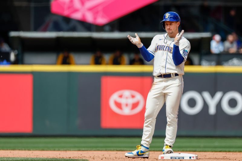 May 28, 2023; Seattle, Washington, USA; Seattle Mariners left fielder Jarred Kelenic (10) reacts after hitting an RBI-double against the Pittsburgh Pirates during the fifth inning at T-Mobile Park. Mandatory Credit: Joe Nicholson-USA TODAY Sports