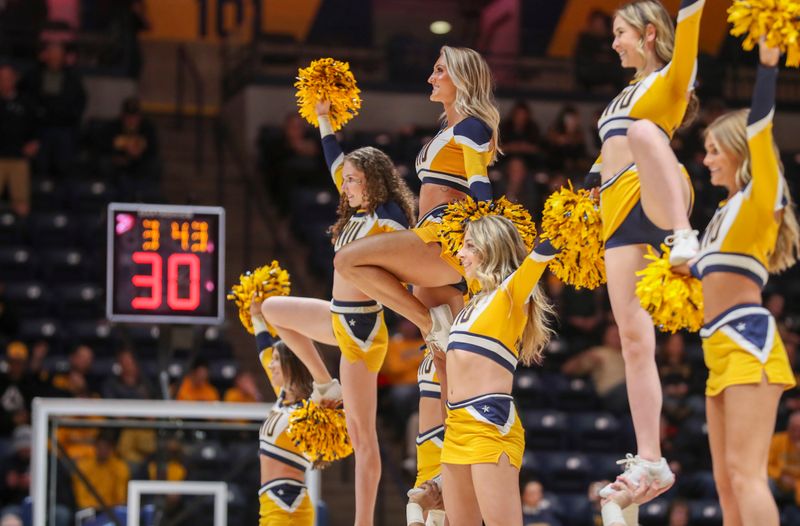 Jan 9, 2024; Morgantown, West Virginia, USA; West Virginia Mountaineers cheerleaders perform during the second half against the Kansas State Wildcats at WVU Coliseum. Mandatory Credit: Ben Queen-USA TODAY Sports