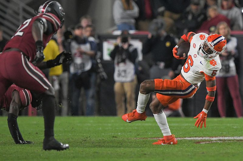 Nov 25, 2023; Columbia, South Carolina, USA; Clemson Tigers receiver Tyler Brown (6) catches a pass against South Carolina Gamecocks edge Jatius Geer (12) during the second quarter at Williams-Brice Stadium. Mandatory Credit: Ken Ruinard-USA TODAY Sports