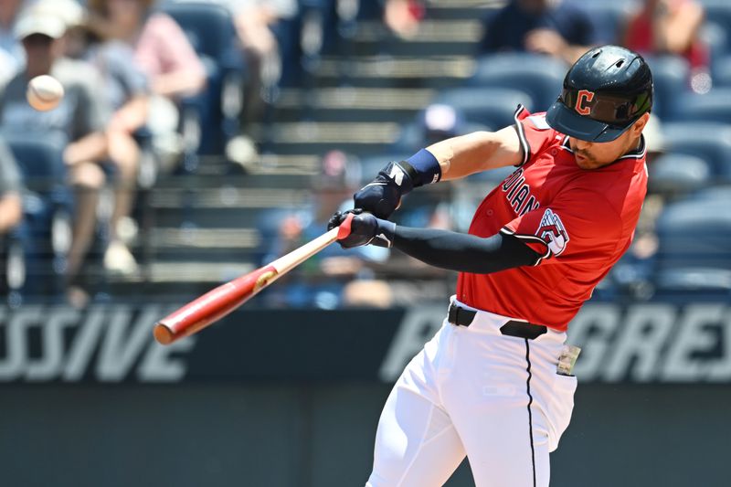 Jun 26, 2025; Cleveland, Ohio, USA; Cleveland Guardians left fielder Steven Kwan (38) hits a double during the first inning against the Toronto Blue Jays at Progressive Field. Mandatory Credit: Ken Blaze-Imagn Images