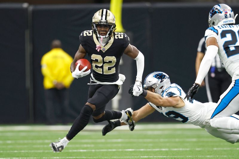 New Orleans Saints wide receiver Rashid Shaheed (22) runs the ball past Carolina Panthers linebacker Jon Rhattigan (49) during an NFL football game, Sunday, Sept. 8, 2024, in New Orleans. (AP Photo/Tyler Kaufman)