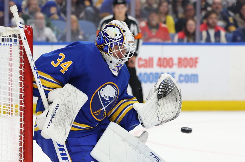 Oct 18, 2025; Buffalo, New York, USA;  Buffalo Sabres goaltender Alex Lyon (34) looks to make a save during the first period against the Florida Panthers at KeyBank Center. Mandatory Credit: Timothy T. Ludwig-Imagn Images