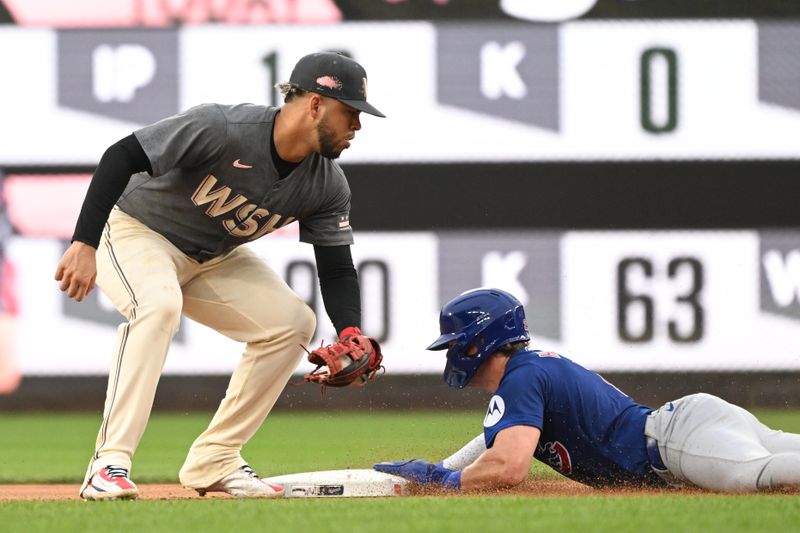 Aug 31, 2024; Washington, District of Columbia, USA; Chicago Cubs second baseman Nico Hoerner (2) dives safely into second base in front of Washington Nationals second baseman Luis Garcia Jr. (2) during the seventh inning at Nationals Park. Mandatory Credit: Rafael Suanes-USA TODAY Sports