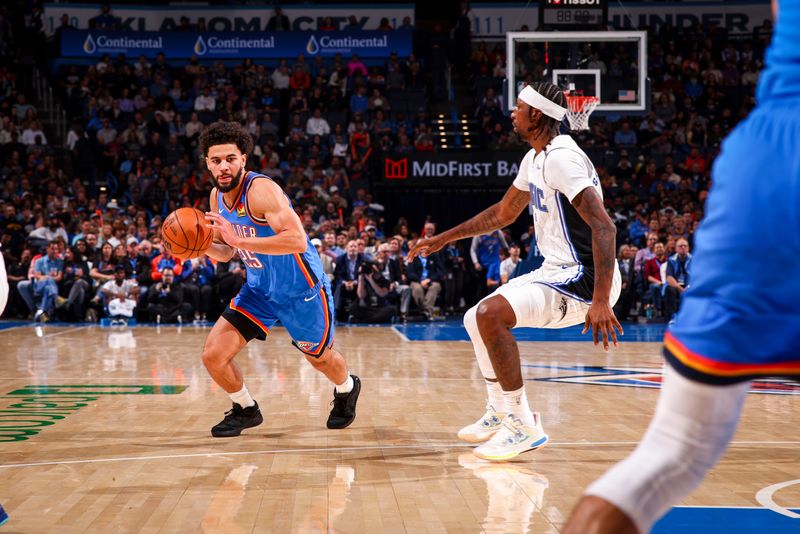 OKLAHOMA CITY, OK - NOVEMBER 4:  Ajay Mitchell #25 of the Oklahoma City Thunder dribbles the ball during the game against the Orlando Magic on November 4, 2024 at Paycom Center in Oklahoma City, Oklahoma. NOTE TO USER: User expressly acknowledges and agrees that, by downloading and or using this photograph, User is consenting to the terms and conditions of the Getty Images License Agreement. Mandatory Copyright Notice: Copyright 2024 NBAE (Photo by Zach Beeker/NBAE via Getty Images)