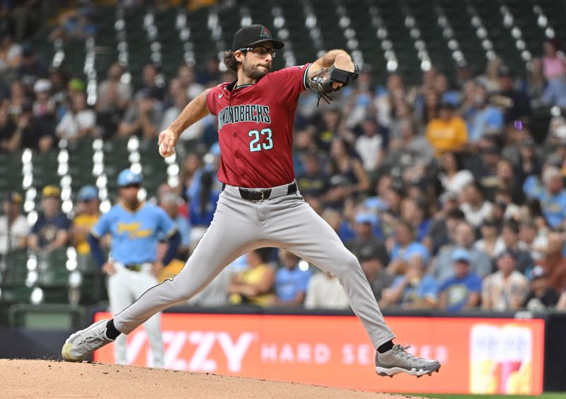 Sep 20, 2024; Milwaukee, Wisconsin, USA; Arizona Diamondbacks pitcher Zac Gallen (23) delivers a pitch against the Milwaukee Brewers in the first inning  at American Family Field. Mandatory Credit: Michael McLoone-Imagn Images