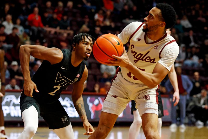 Jan 23, 2024; Blacksburg, Virginia, USA; Boston College Eagles guard Jack Di Donna (15) shoots the ball against Virginia Tech Hokies guard MJ Collins (2) during the first half at Cassell Coliseum. Mandatory Credit: Peter Casey-USA TODAY Sports