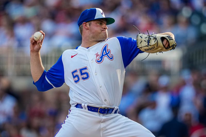 Jul 29, 2023; Cumberland, Georgia, USA; Atlanta Braves starting pitcher Bryce Elder (55) pitches against the Milwaukee Brewers during the first inning at Truist Park. Mandatory Credit: Dale Zanine-USA TODAY Sports