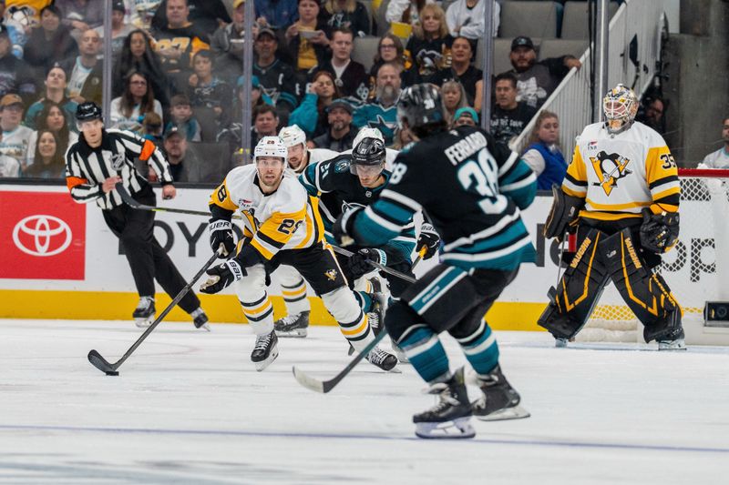 Oct 18, 2025; San Jose, California, USA; Pittsburgh Penguins defenseman Parker Wotherspoon (28) controls the puck against San Jose Sharks center Alexander Wennberg (21) during the second period at SAP Center at San Jose. Mandatory Credit: Neville E. Guard-Imagn Images