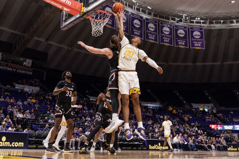 Feb 18, 2023; Baton Rouge, Louisiana, USA; LSU Tigers forward Derek Fountain (20) grabs a rebound against South Carolina Gamecocks forward Hayden Brown (10) at Pete Maravich Assembly Center. Mandatory Credit: Stephen Lew-USA TODAY Sports