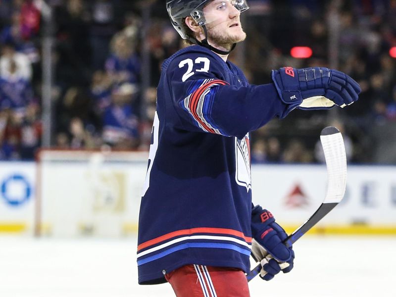 uMar 23, 2024; New York, New York, USA; New York Rangers defenseman Adam Fox (23) signals to his teammates after scoring a goal in the second period against the Florida Panthers at Madison Square Garden. Mandatory Credit: Wendell Cruz-USA TODAY Sports