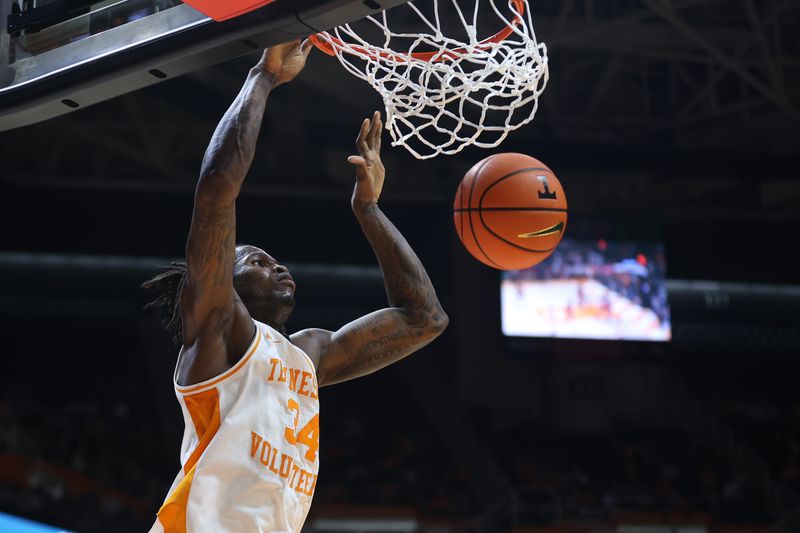 Feb 18, 2026; Knoxville, Tennessee, USA;  Tennessee Volunteers center Felix Okpara (34) dunks the ball against the Oklahoma Sooners during the first half at Thompson-Boling Arena at Food City Center. Mandatory Credit: Randy Sartin-Imagn Images