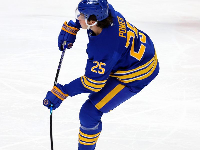 Nov 1, 2025; Buffalo, New York, USA;  Buffalo Sabres defenseman Owen Power (25) takes a shot on goal during the second period against the Washington Capitals at KeyBank Center. Mandatory Credit: Timothy T. Ludwig-Imagn Images