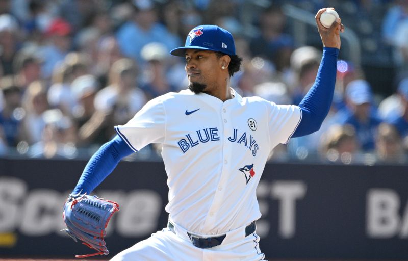 Sep 15, 2024; Toronto, Ontario, CAN;  Toronto Blue Jays relief pitcher Genesis Cabrera (92) delivers a pitch against the St. Louis Cardinals in the eighth inning at Rogers Centre. Mandatory Credit: Dan Hamilton-Imagn Images