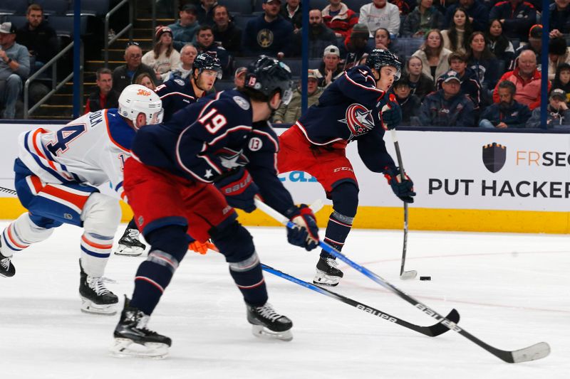 Oct 28, 2024; Columbus, Ohio, USA; Columbus Blue Jackets left wing Mikael Pyyhtia (82) wrists a shot on goal against the Edmonton Oilers during the second period at Nationwide Arena. Mandatory Credit: Russell LaBounty-Imagn Images