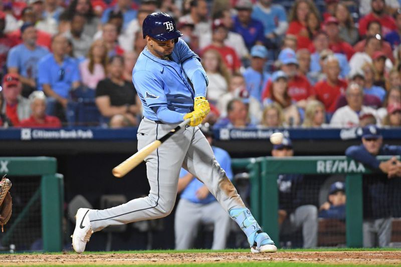 Sep 10, 2024; Philadelphia, Pennsylvania, USA; Tampa Bay Rays third base Christopher Morel (24) hits an RBI triple during the sixth inning against the Philadelphia Phillies at Citizens Bank Park. Mandatory Credit: Eric Hartline-Imagn Images