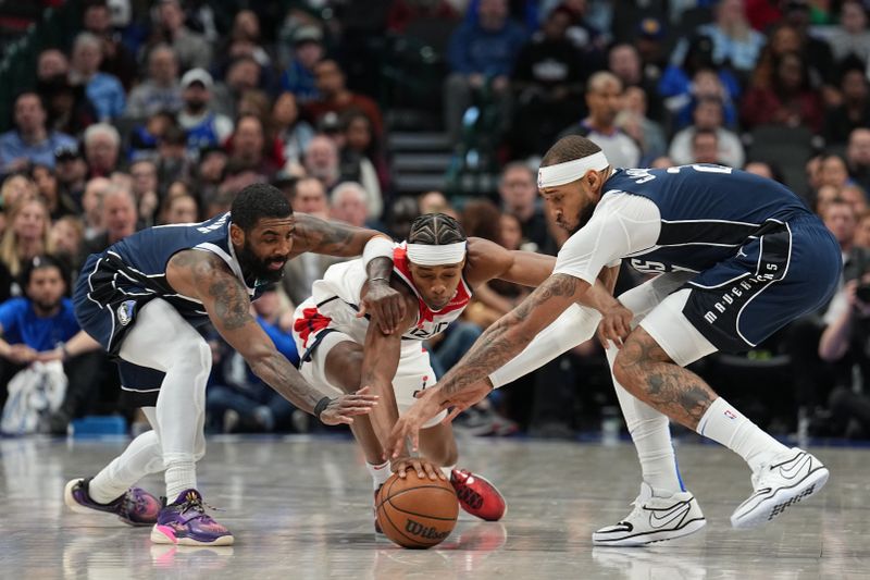 DALLAS, TX - FEBRUARY 12: Kyrie Irving #11  and Daniel Gafford #21 of the Dallas Mavericks battle Bilal Coulibaly #0 of the Washington Wizards for a loose ball on February 12, 2024 at the American Airlines Center in Dallas, Texas. NOTE TO USER: User expressly acknowledges and agrees that, by downloading and or using this photograph, User is consenting to the terms and conditions of the Getty Images License Agreement. Mandatory Copyright Notice: Copyright 2024 NBAE (Photo by Glenn James/NBAE via Getty Images)