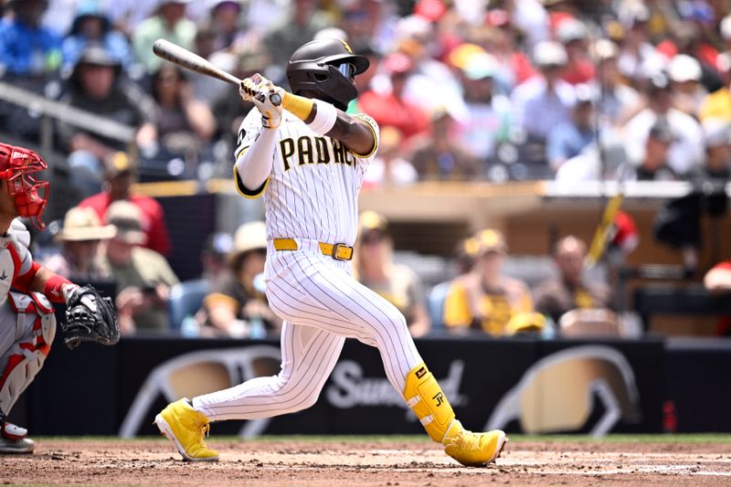 May 1, 2024; San Diego, California, USA; San Diego Padres left fielder Jurickson Profar (10) hits a single against the Cincinnati Reds during the third inning at Petco Park. Mandatory Credit: Orlando Ramirez-USA TODAY Sports