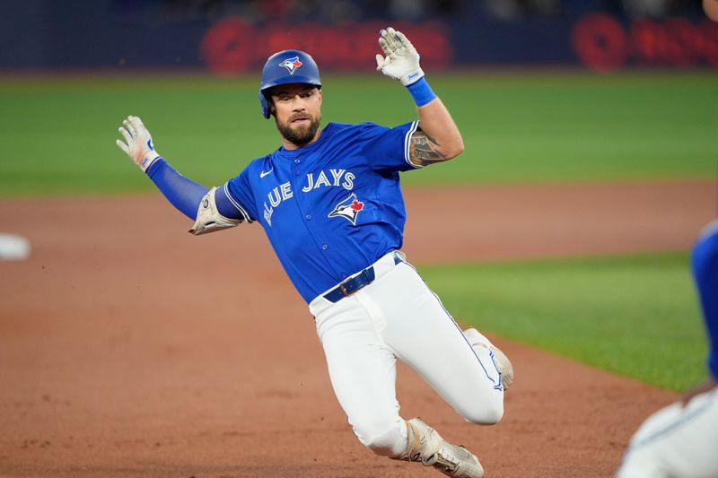 Sep 25, 2025; Toronto, Ontario, CAN; Toronto Blue Jays right fielder Nathan Lukes (38) slides into third base on a triple against the Boston Red Sox during the first inning at Rogers Centre. Mandatory Credit: John E. Sokolowski-Imagn Images
