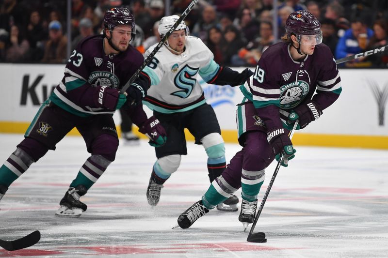 Dec 23, 2023; Anaheim, California, USA; Anaheim Ducks right wing Troy Terry (19) moves the puck against the Seattle Kraken during the second period at Honda Center. Mandatory Credit: Gary A. Vasquez-USA TODAY Sports