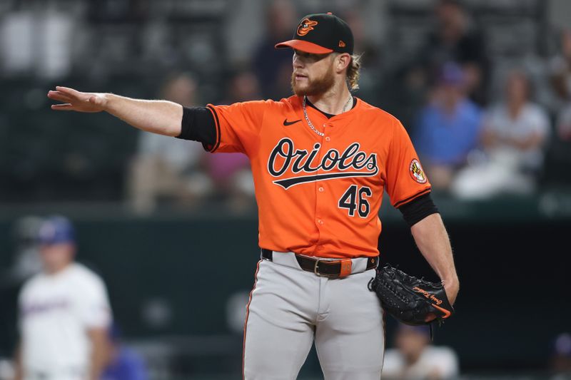 Jul 20, 2024; Arlington, Texas, USA; Baltimore Orioles pitcher Craig Kimbrel (46) points to second base in the ninth inning against the Texas Rangers at Globe Life Field. Mandatory Credit: Tim Heitman-USA TODAY Sports