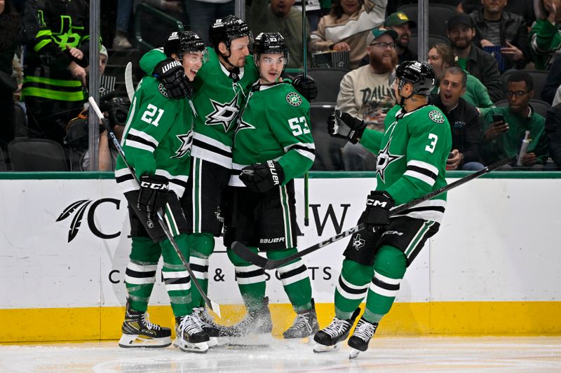 Nov 20, 2024; Dallas, Texas, USA; Dallas Stars center Wyatt Johnston (53) and center Roope Hintz (24) and left wing Jason Robertson (21) and defenseman Mathew Dumba (3) celebrates a goal scored by Johnston against the San Jose Sharks during the second period at the American Airlines Center. Mandatory Credit: Jerome Miron-Imagn Images