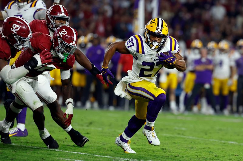 Nov 4, 2023; Tuscaloosa, Alabama, USA; LSU Tigers running back Josh Williams (27) carries the ball in for a touchdown against the Alabama Crimson Tide during the second half at Bryant-Denny Stadium. Mandatory Credit: Butch Dill-USA TODAY Sports