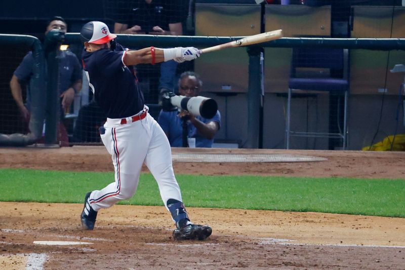 Aug 29, 2023; Minneapolis, Minnesota, USA; Minnesota Twins designated hitter Royce Lewis (23) hits a solo home run against the Cleveland Guardians in the fourth inning at Target Field. Mandatory Credit: Bruce Kluckhohn-USA TODAY Sports