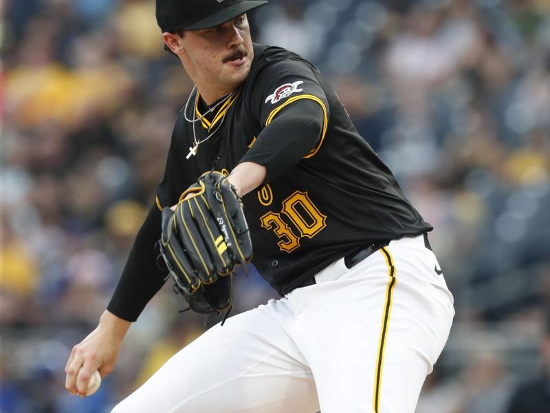 Jun 5, 2024; Pittsburgh, Pennsylvania, USA;  Pittsburgh Pirates starting pitcher Paul Skenes (30) delivers a pitch against the Los Angeles Dodgers during the first inning at PNC Park. Mandatory Credit: Charles LeClaire-USA TODAY Sports