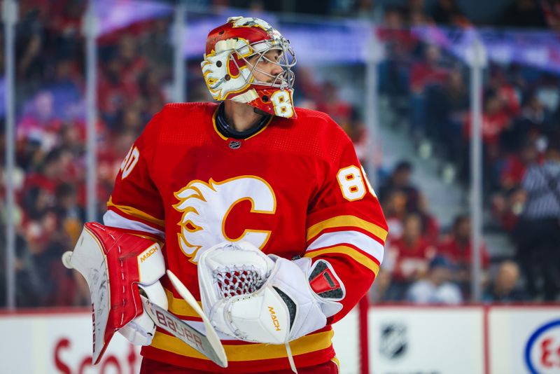 Nov 1, 2022; Calgary, Alberta, CAN; Calgary Flames goaltender Dan Vladar (80) reacts during the first period against the Seattle Kraken at Scotiabank Saddledome. Mandatory Credit: Sergei Belski-USA TODAY Sports