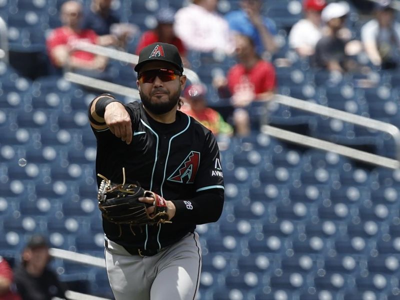 Jun 20, 2024; Washington, District of Columbia, USA; Arizona Diamondbacks third base Eugenio Suárez (28) makes a throw to first base on a ground ball by Washington Nationals outfielder Jesse Winker (not pictured) during the third inning at Nationals Park. Mandatory Credit: Geoff Burke-USA TODAY Sports