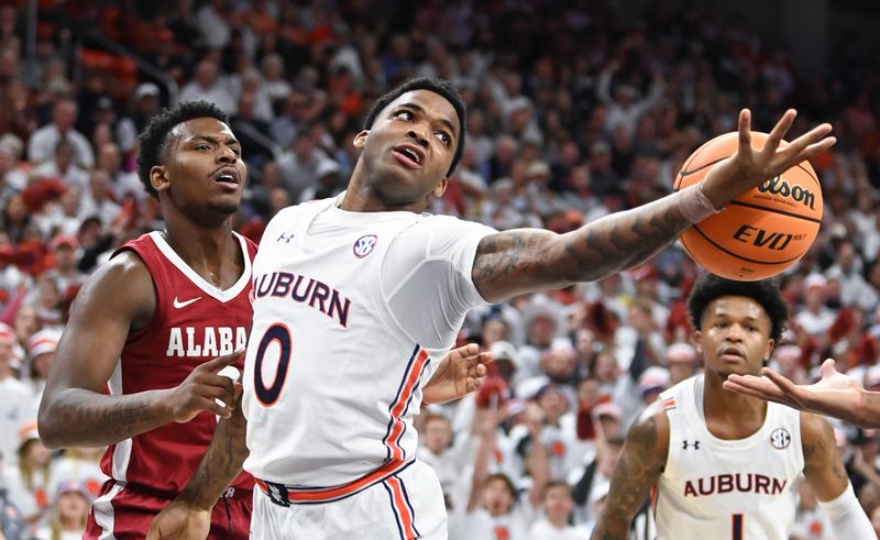 Feb 11, 2023; Auburn, Alabama, USA;  Auburn Tigers guard K.D. Johnson (0) misses a rebound during an NCAA game against Alabama Crimson Tide at Neville Arena. Mandatory Credit: Julie Bennett-USA TODAY Sports

