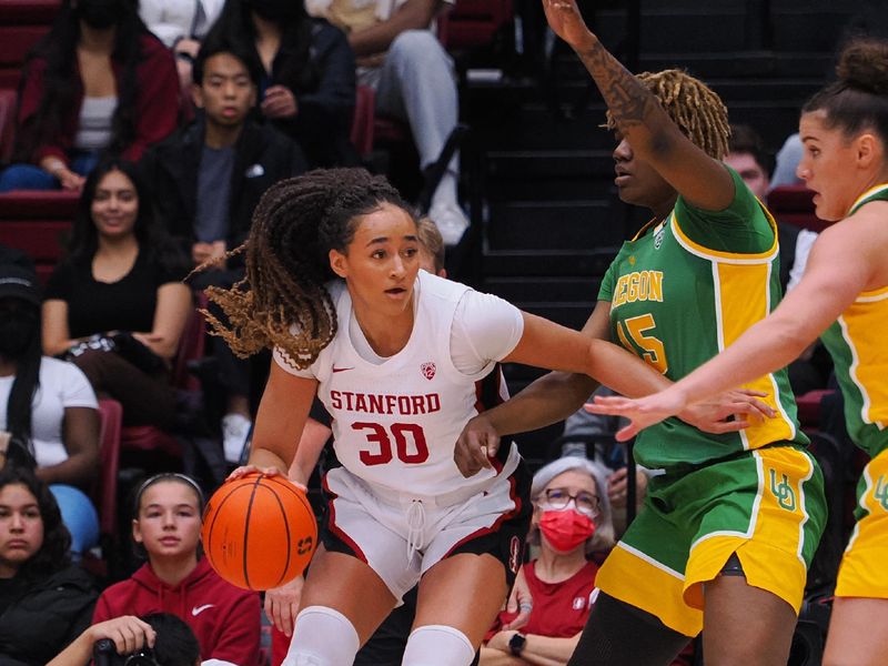 Jan 29, 2023; Stanford, California, USA; Stanford Cardinal guard Haley Jones (30) controls the ball against Oregon Ducks center Phillipina Kyei (15) during the first quarter at Maples Pavilion. Mandatory Credit: Kelley L Cox-USA TODAY Sports