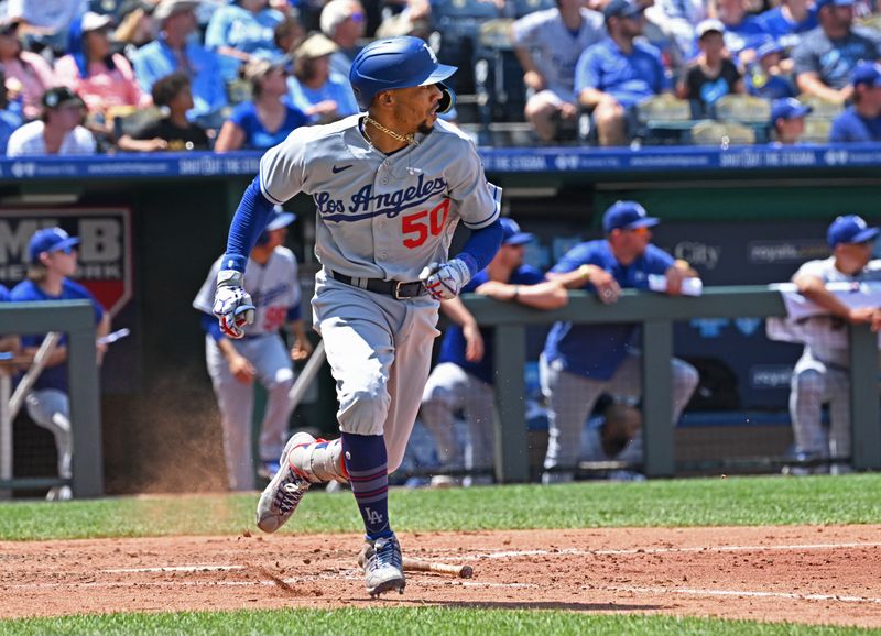 Jul 2, 2023; Kansas City, Missouri, USA;  Los Angeles Dodgers shortstop Mookie Betts (50) doubles in the fifth inning against the Kansas City Royals at Kauffman Stadium. Mandatory Credit: Peter Aiken-USA TODAY Sports