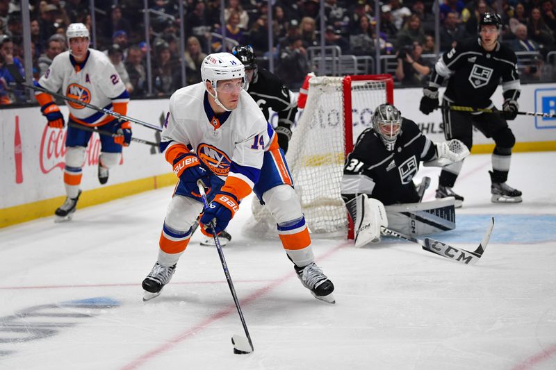 Mar 11, 2024; Los Angeles, California, USA; New York Islanders center Bo Horvat (14) controls the puck against the Los Angeles Kings during the third period at Crypto.com Arena. Mandatory Credit: Gary A. Vasquez-USA TODAY Sports