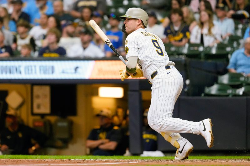 May 16, 2025; Milwaukee, Wisconsin, USA;  Milwaukee Brewers first baseman Jake Bauers (9) singles during the seventh inning against the Minnesota Twins at American Family Field. Mandatory Credit: Jeff Hanisch-Imagn Images