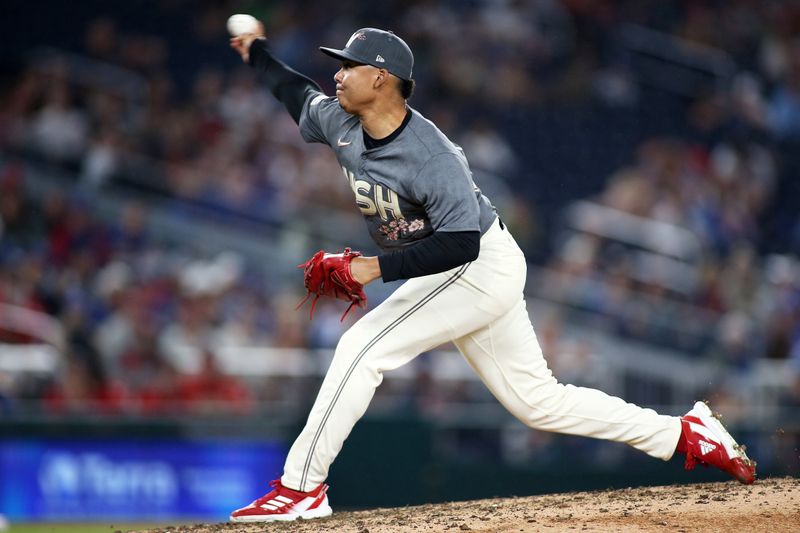 Aug 30, 2024; Washington, District of Columbia, USA; Washington Nationals pitcher Eduardo Salazar (62) pitches during the eighth inning against the Chicago Cubs at Nationals Park. Mandatory Credit: Daniel Kucin Jr.-USA TODAY Sports


